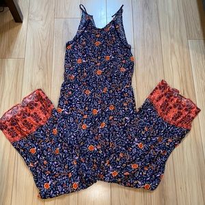 NWT Floral jumpsuit with red bottoms